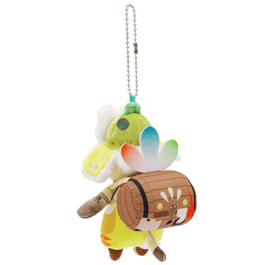 A USJ exclusive Monster Hunter Palico plush keychain. The adorable Felyne mascot is wearing a yellow and green outfit, a red bandana, and a white furry hat with a red paw print. It is carrying a brown barrel backpack and features a silver ball chain at the top for easy attachment.