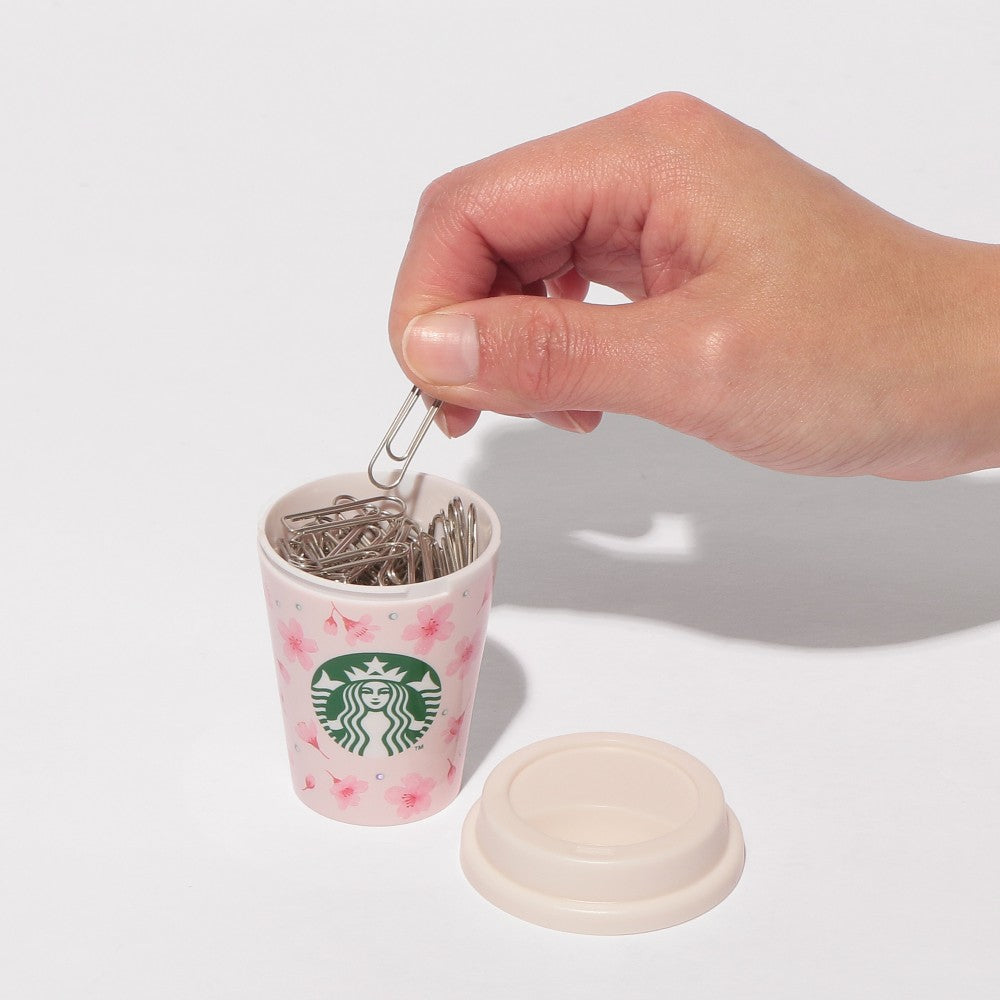Starbucks Japan SAKURA Shine Brightly 2026 collection merchandise. Limited edition series featuring glitter pink stainless bottles, Stanley collaboration tumblers in pink gradient, and color-changing cups. The design theme highlights vivid spring colors, metallic gold accents, and bright cherry blossom patterns.