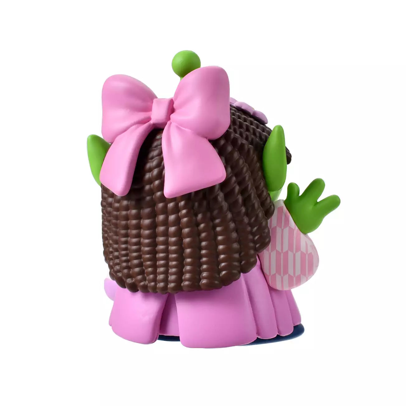 A cute collectible figure of a Little Green Man (Alien) wearing a pink wig with brown pigtails and a traditional pink hakama kimono. The character holds a small flower-shaped purse and waves with one hand. The backdrop features a pink striped pattern with delicate cherry blossom illustrations.