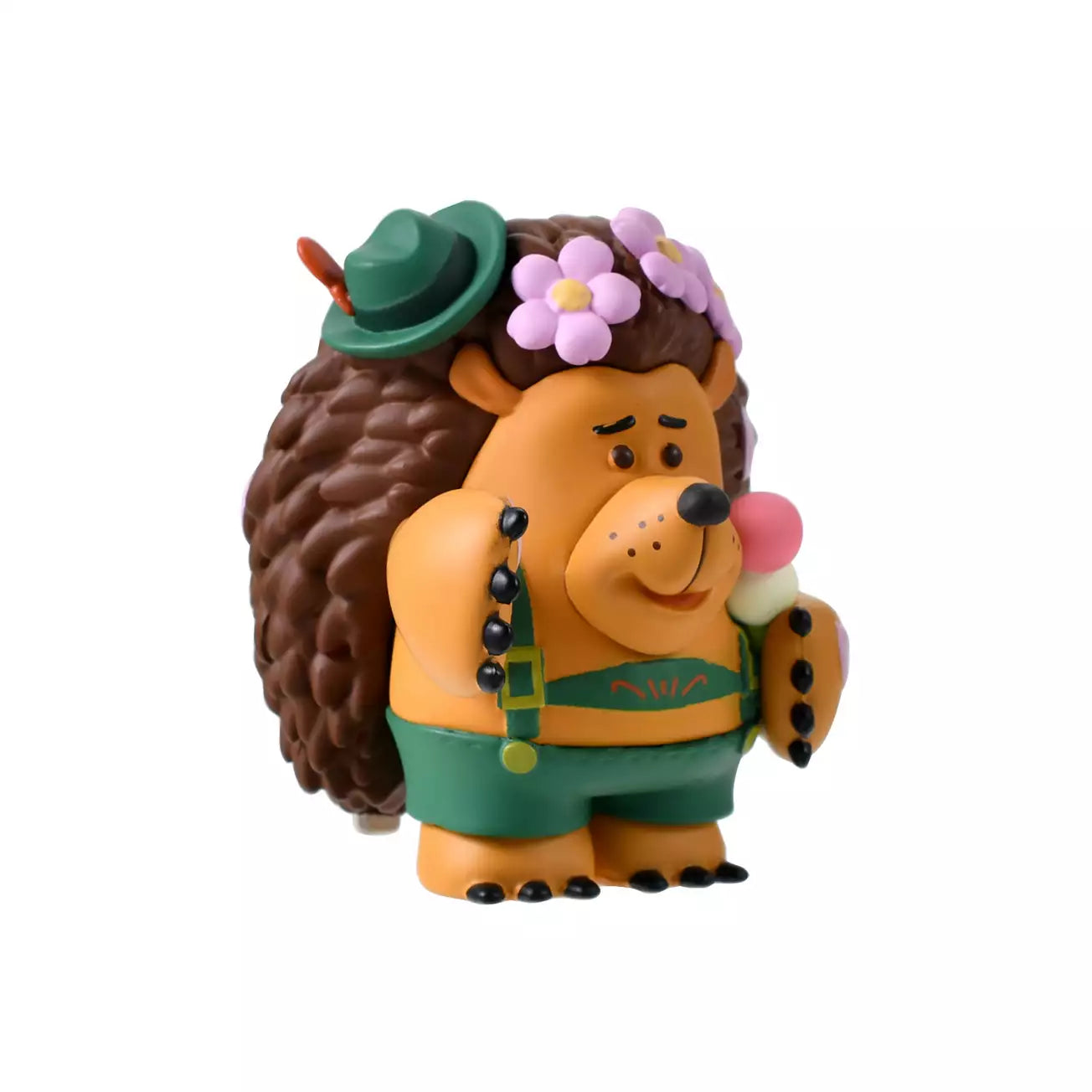 A figure of Mr. Pricklepants from Toy Story 3 enjoying a spring picnic. The hedgehog wears green lederhosen and a small green hat. He holds a 'Hanami Dango' (a three-colored sweet dumpling) in one hand and has a crown of pink cherry blossoms on his head. The background is pink with falling sakura petals.