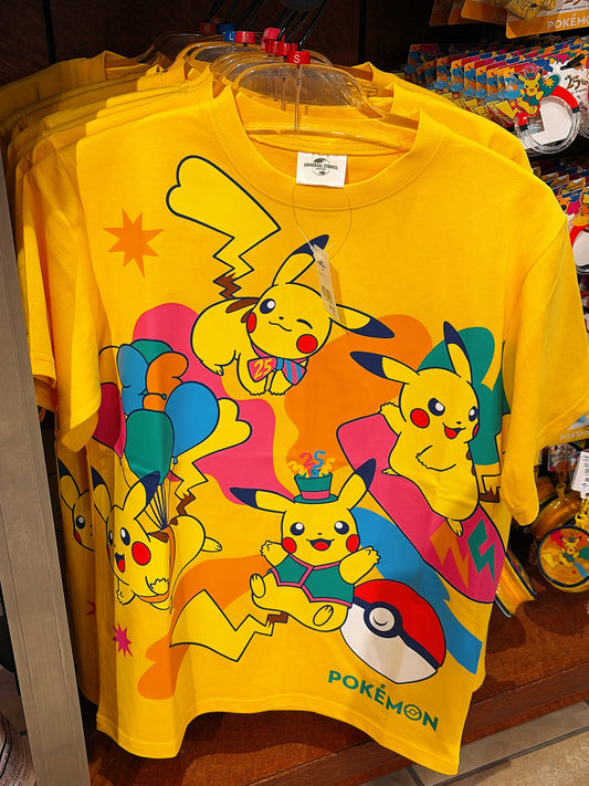 A limited-edition T-shirt from the exclusive Universal Studios Japan 25th Anniversary Pokémon 'Discover U!!!' collection, featuring festive celebratory designs.