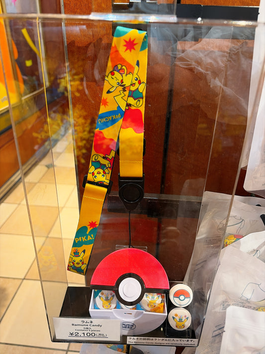 A limited-edition candy with lanyard from the exclusive Universal Studios Japan 25th Anniversary Pokémon 'Discover U!!!' collection, featuring festive celebratory designs.