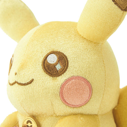 Close-up of the exclusive Pokémon 30th Anniversary Pikachu plush, showing the special golden 'Since 1996' woven tag and delicate glitter fabric.