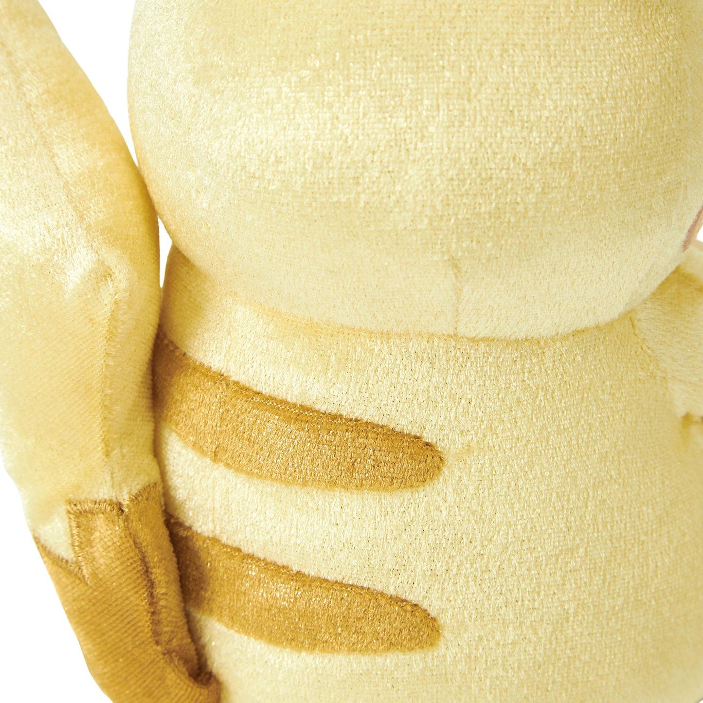 Close-up of the exclusive Pokémon 30th Anniversary Pikachu plush, showing the special golden 'Since 1996' woven tag and delicate glitter fabric.
