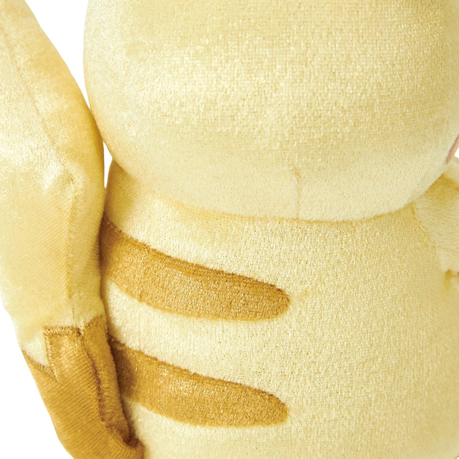 Close-up of the exclusive Pokémon 30th Anniversary Pikachu plush, showing the special golden 'Since 1996' woven tag and delicate glitter fabric.