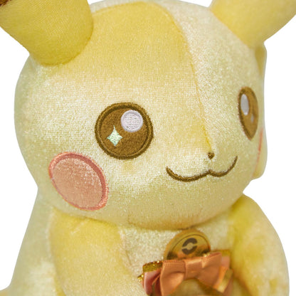 Close-up of the exclusive Pokémon 30th Anniversary Pikachu plush, showing the special golden 'Since 1996' woven tag and delicate glitter fabric.