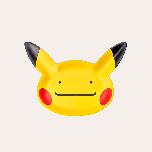 Yellow plate shaped Pikachu with a face showing that it is actually Ditto. Shop at LEALEA MART.