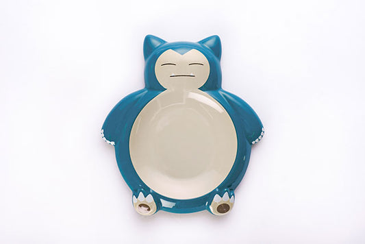 Blue and white ceramic plate shaped Snorlax.