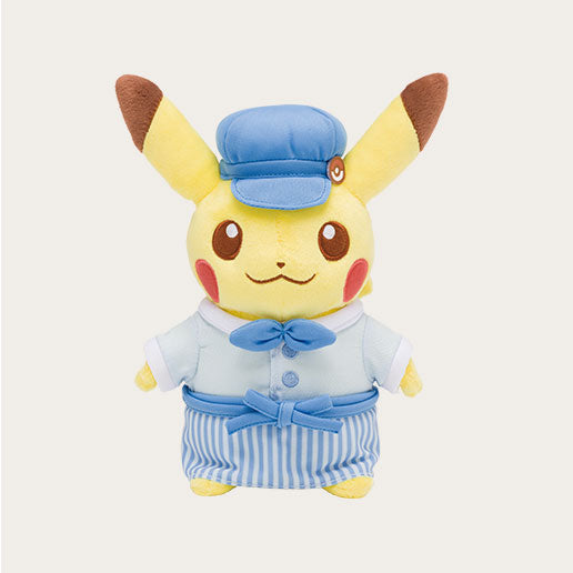 A display of exclusive merchandise from the Pokémon Cafe in Japan. The image features a "Chef Pikachu" plush toy wearing a red hat and apron, alongside a "Waitress Pikachu" plush.