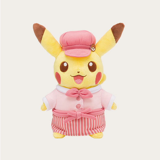 A display of exclusive merchandise from the Pokémon Cafe in Japan. The image features a "Chef Pikachu" plush toy wearing a red hat and apron, alongside a "Waitress Pikachu" plush.