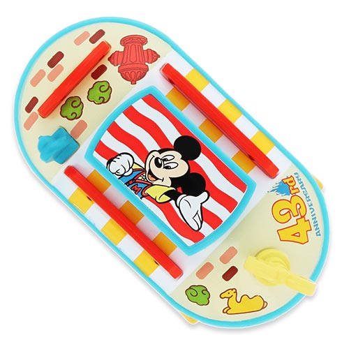 Limited-edition Tokyo Disneyland 43rd Anniversary Tomica die-cast car modeled after the Toontown Jolly Trolley.