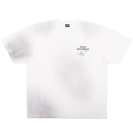 A white oversized t-shirt from the USJ UNIVRS collection featuring a tie-dye effect and a small graphic of Woody Woodpecker laughing with the text 'WOODY WOODPECKER'.