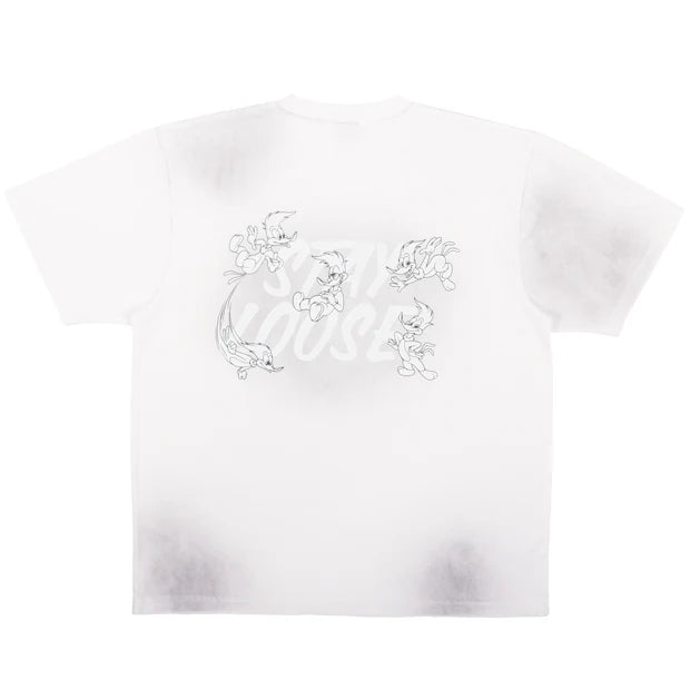 A white oversized t-shirt from the USJ UNIVRS collection featuring a tie-dye effect and a small graphic of Woody Woodpecker laughing with the text 'WOODY WOODPECKER'.