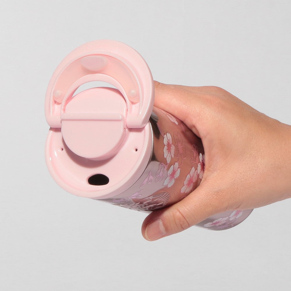 Starbucks Japan SAKURA Shine Brightly 2026 collection merchandise. Limited edition series featuring glitter pink stainless bottles, Stanley collaboration tumblers in pink gradient, and color-changing cups. The design theme highlights vivid spring colors, metallic gold accents, and bright cherry blossom patterns.