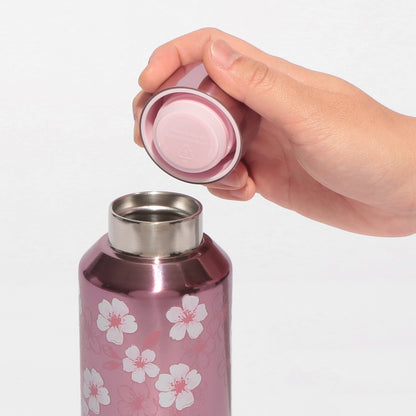 Starbucks Japan SAKURA Shine Brightly 2026 collection merchandise. Limited edition series featuring glitter pink stainless bottles, Stanley collaboration tumblers in pink gradient, and color-changing cups. The design theme highlights vivid spring colors, metallic gold accents, and bright cherry blossom patterns.