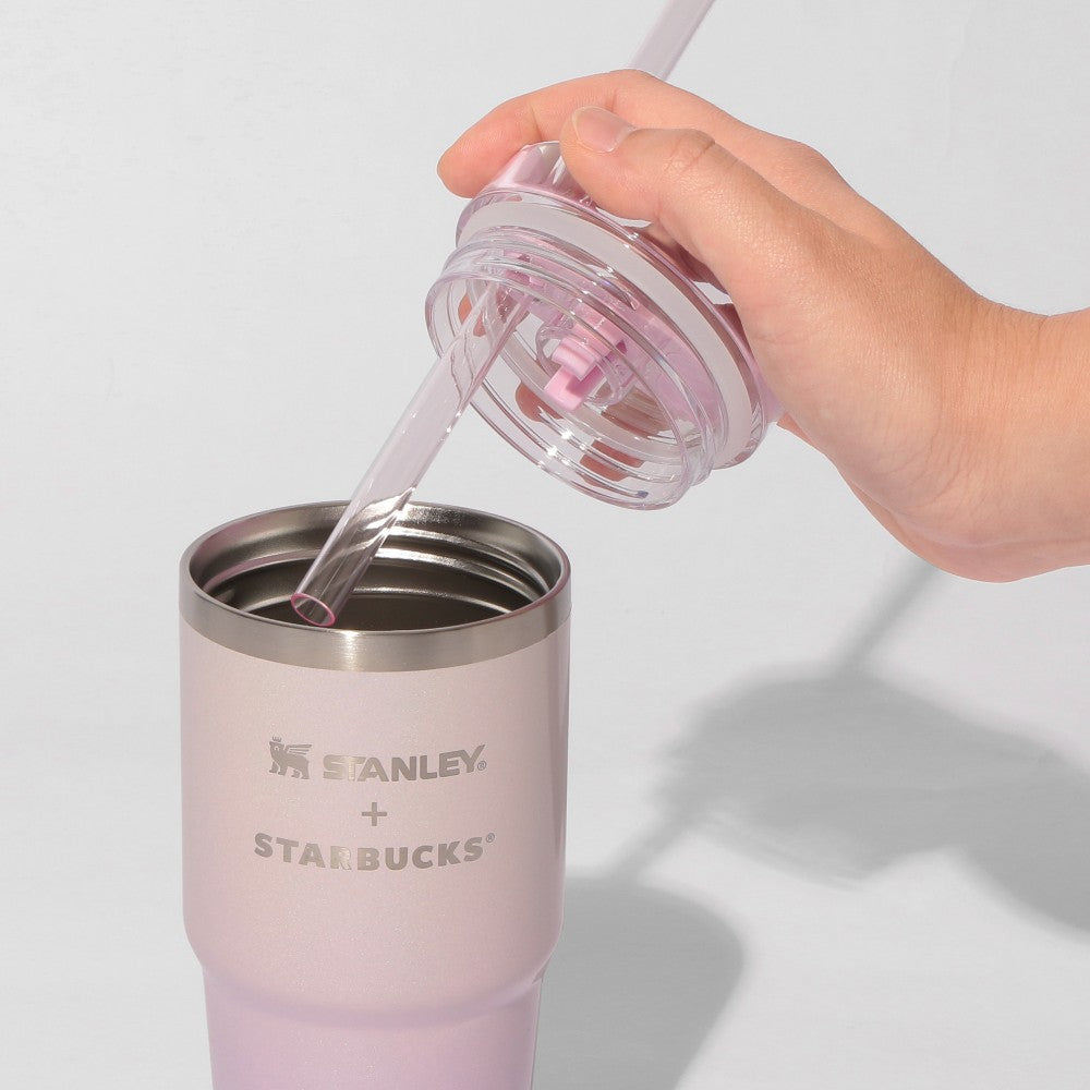 Starbucks Japan SAKURA Shine Brightly 2026 collection merchandise. Limited edition series featuring glitter pink stainless bottles, Stanley collaboration tumblers in pink gradient, and color-changing cups. The design theme highlights vivid spring colors, metallic gold accents, and bright cherry blossom patterns.