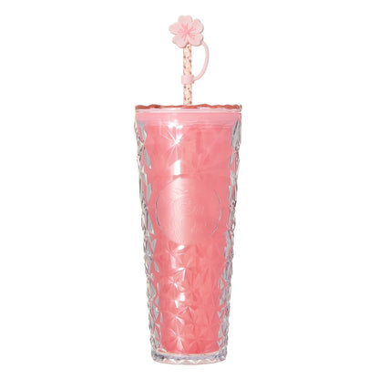Starbucks Japan SAKURA Shine Brightly 2026 collection merchandise. Limited edition series featuring glitter pink stainless bottles, Stanley collaboration tumblers in pink gradient, and color-changing cups. The design theme highlights vivid spring colors, metallic gold accents, and bright cherry blossom patterns.