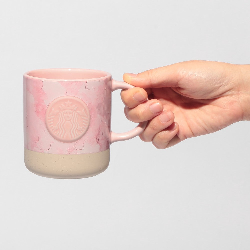 Starbucks Japan SAKURA Shine Brightly 2026 collection merchandise. Limited edition series featuring glitter pink stainless bottles, Stanley collaboration tumblers in pink gradient, and color-changing cups. The design theme highlights vivid spring colors, metallic gold accents, and bright cherry blossom patterns.