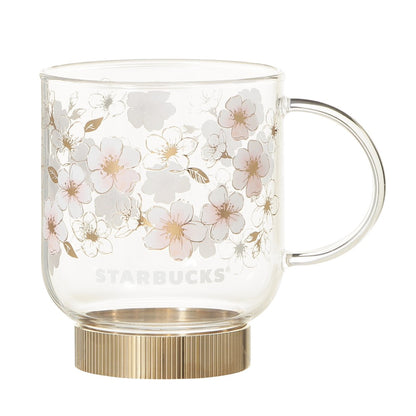 Starbucks Japan SAKURA Shine Brightly 2026 collection merchandise. Limited edition series featuring glitter pink stainless bottles, Stanley collaboration tumblers in pink gradient, and color-changing cups. The design theme highlights vivid spring colors, metallic gold accents, and bright cherry blossom patterns.