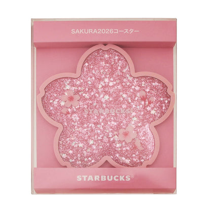 Starbucks Japan SAKURA Shine Brightly 2026 collection merchandise. Limited edition series featuring glitter pink stainless bottles, Stanley collaboration tumblers in pink gradient, and color-changing cups. The design theme highlights vivid spring colors, metallic gold accents, and bright cherry blossom patterns.