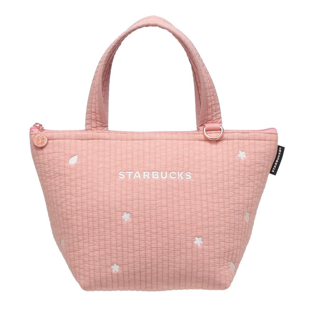 Starbucks Japan SAKURA Shine Brightly 2026 collection merchandise. Limited edition series featuring glitter pink stainless bottles, Stanley collaboration tumblers in pink gradient, and color-changing cups. The design theme highlights vivid spring colors, metallic gold accents, and bright cherry blossom patterns.