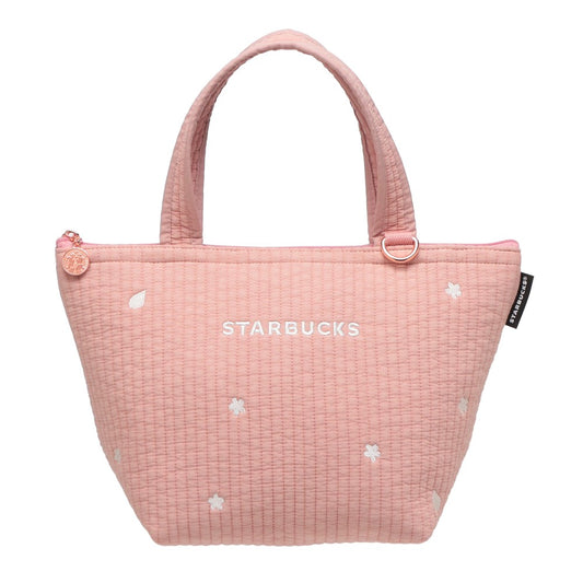 Starbucks Japan SAKURA Shine Brightly 2026 collection merchandise. Limited edition series featuring glitter pink stainless bottles, Stanley collaboration tumblers in pink gradient, and color-changing cups. The design theme highlights vivid spring colors, metallic gold accents, and bright cherry blossom patterns.