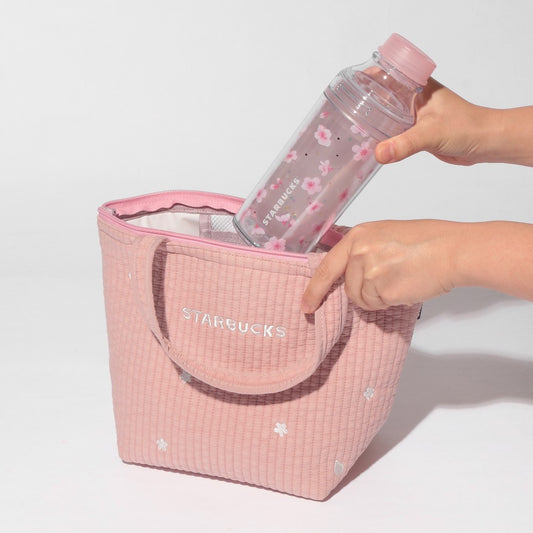 Starbucks Japan SAKURA Shine Brightly 2026 collection merchandise. Limited edition series featuring glitter pink stainless bottles, Stanley collaboration tumblers in pink gradient, and color-changing cups. The design theme highlights vivid spring colors, metallic gold accents, and bright cherry blossom patterns.