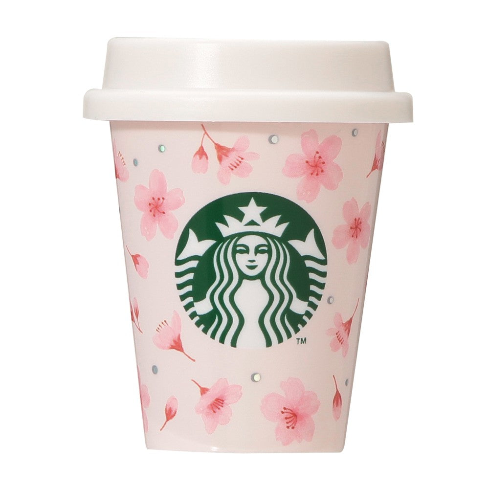 Starbucks Japan SAKURA Shine Brightly 2026 collection merchandise. Limited edition series featuring glitter pink stainless bottles, Stanley collaboration tumblers in pink gradient, and color-changing cups. The design theme highlights vivid spring colors, metallic gold accents, and bright cherry blossom patterns.